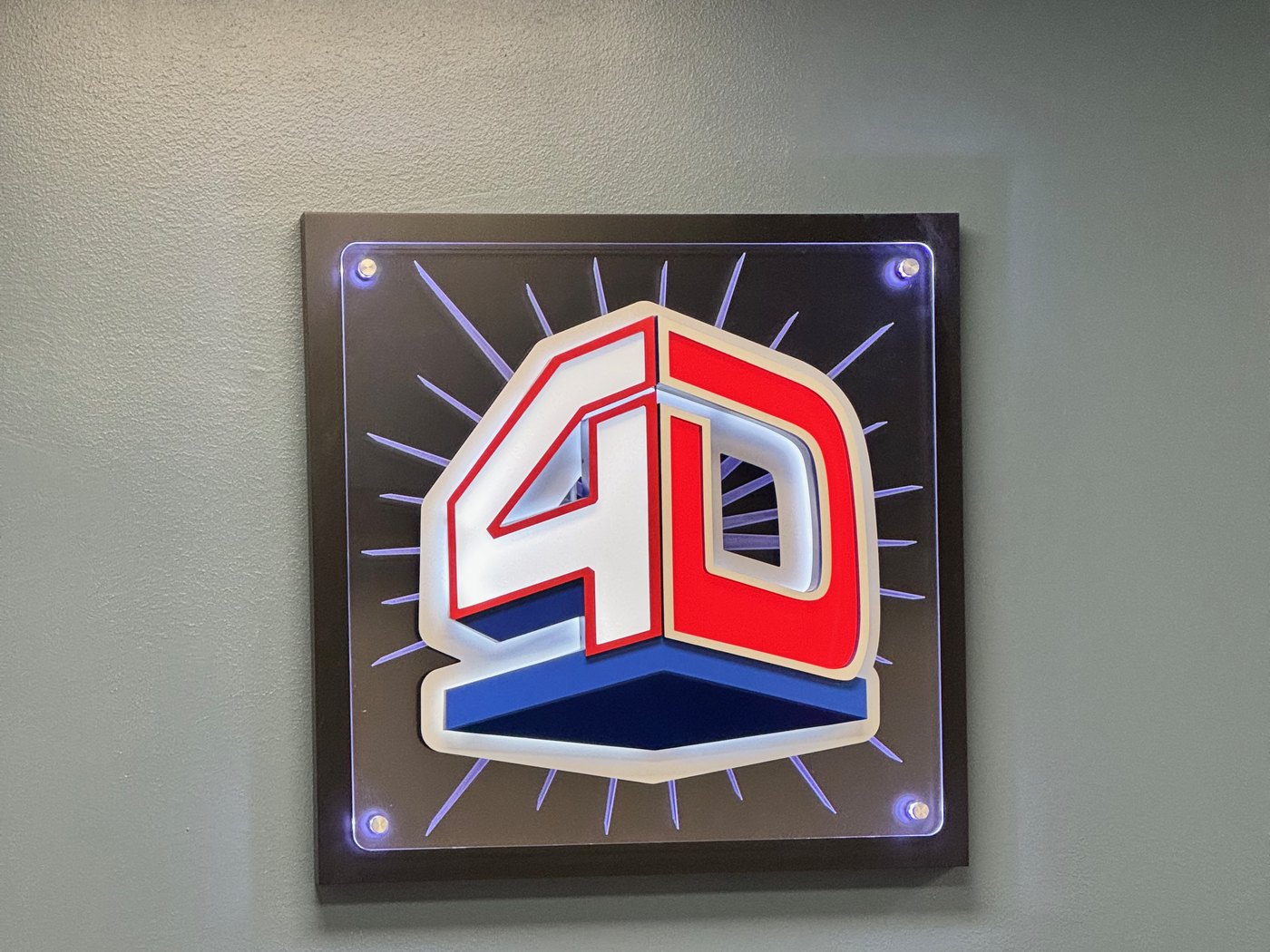 The 4D SignWorx lobby with the lit company logo in Houston