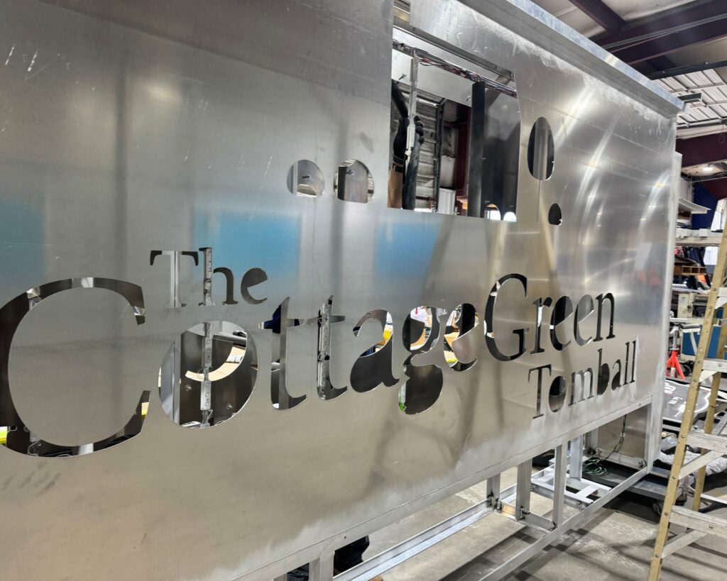 Polished stainless dimensional letters for The Cottage Green in the 4D SignWorx Houston shop