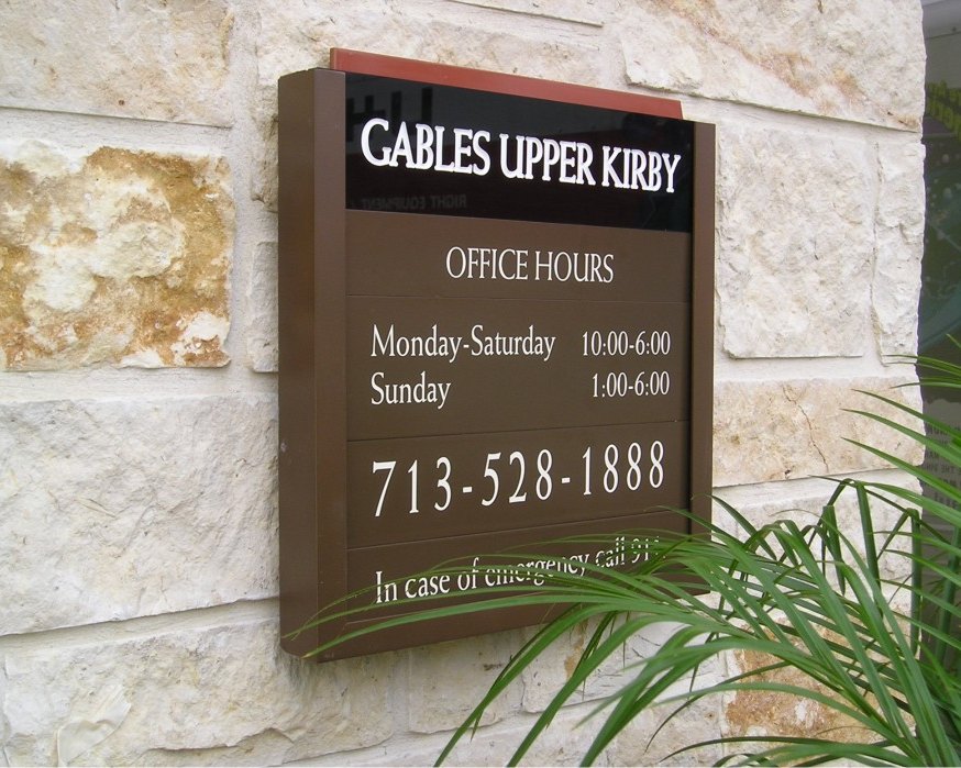 A stone-mounted office and amenity plaque for Gables Upper Kirby, built by 4D SignWorx in Houston