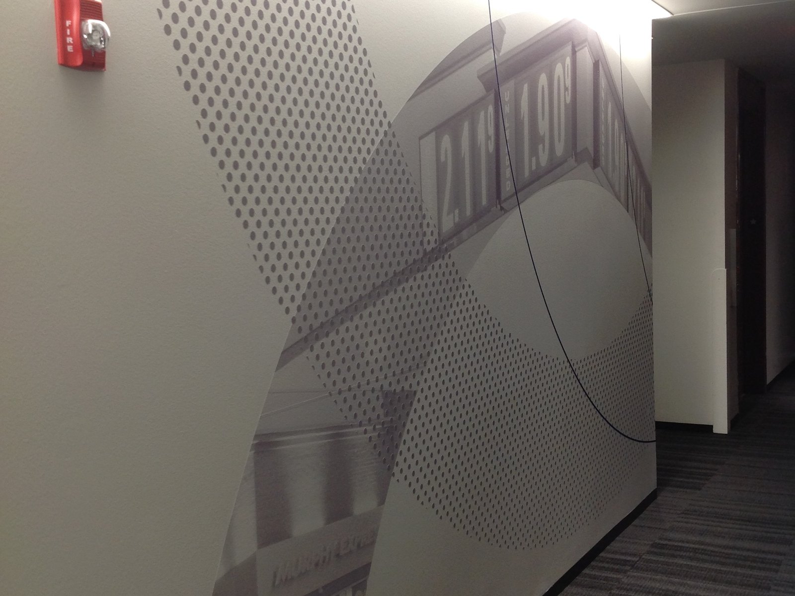 A custom perforated-metal feature wall installed as interior architectural signage by 4D SignWorx in Houston