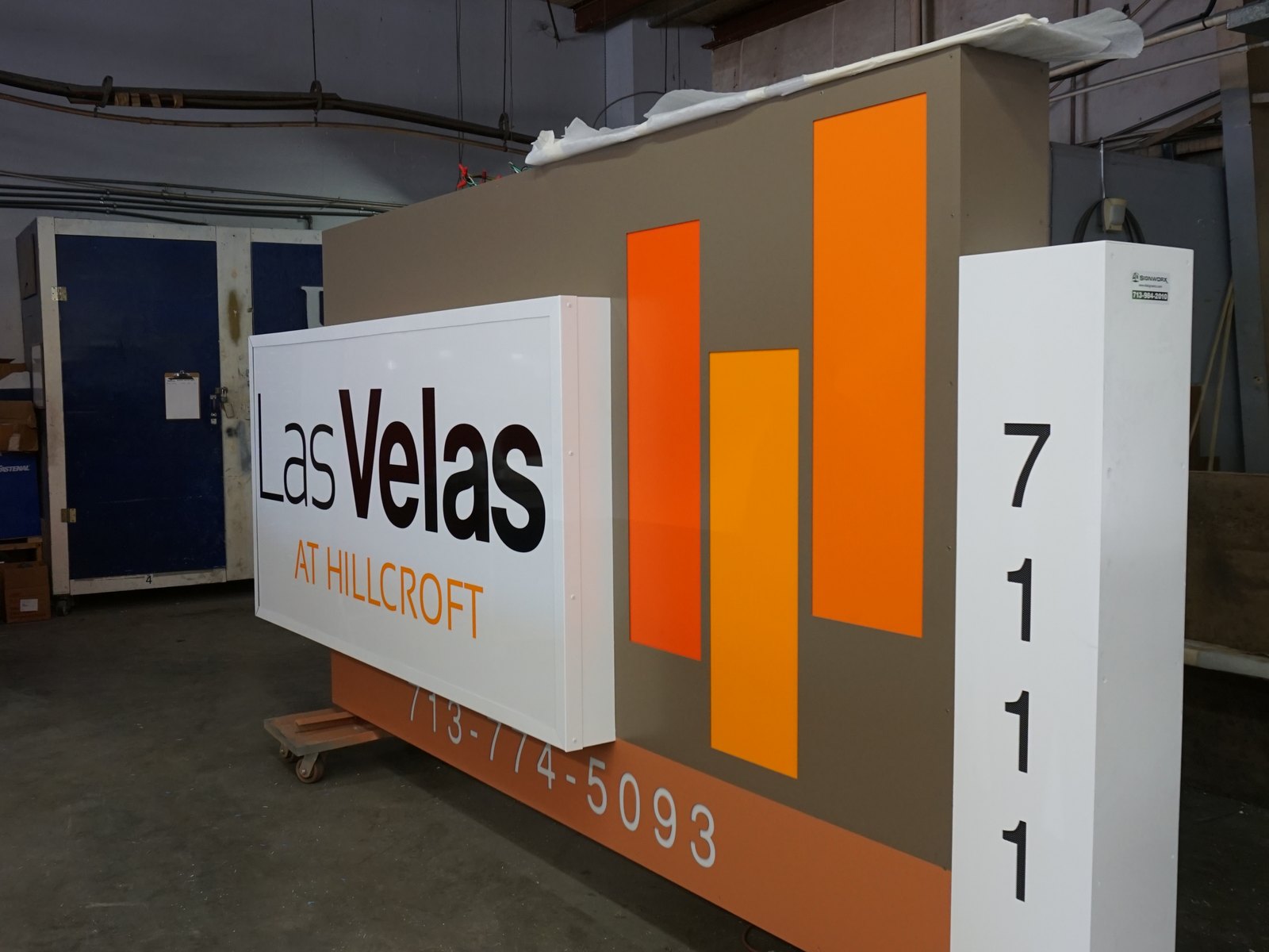 A large illuminated LED sign cabinet for Las Velas under fabrication on the 4D SignWorx shop floor in Houston