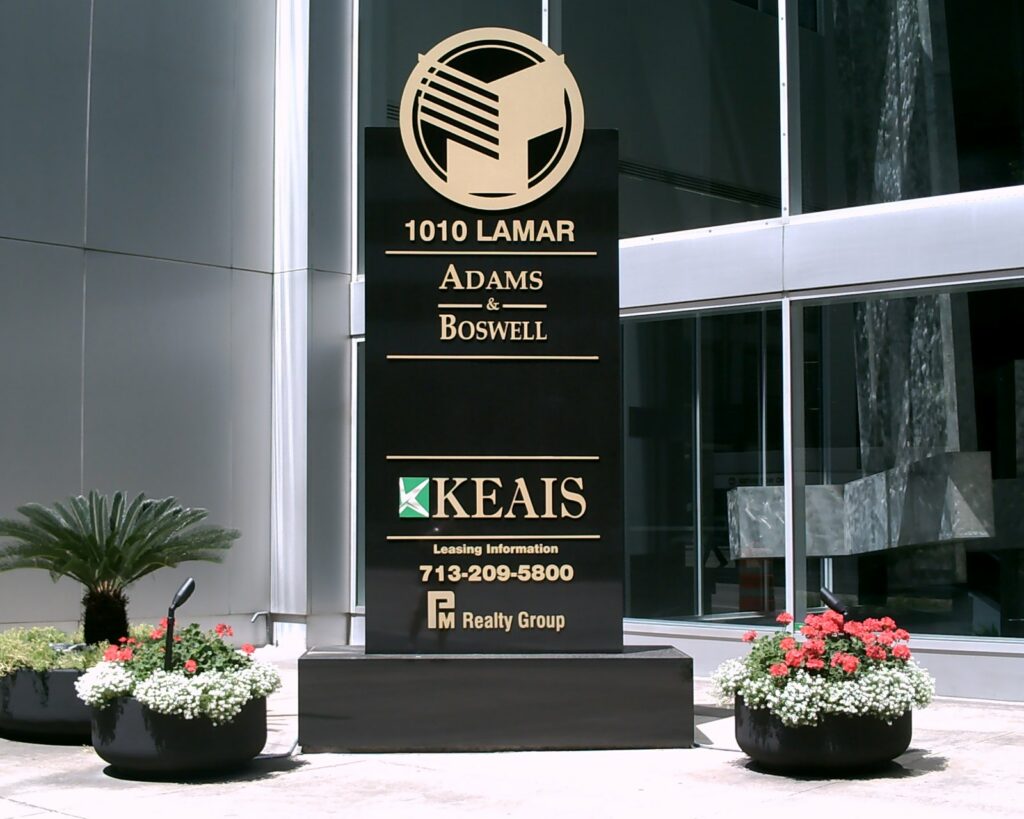 A black granite multi-tenant monument at 1010 Lamar listing office tenants, built by 4D SignWorx in Houston