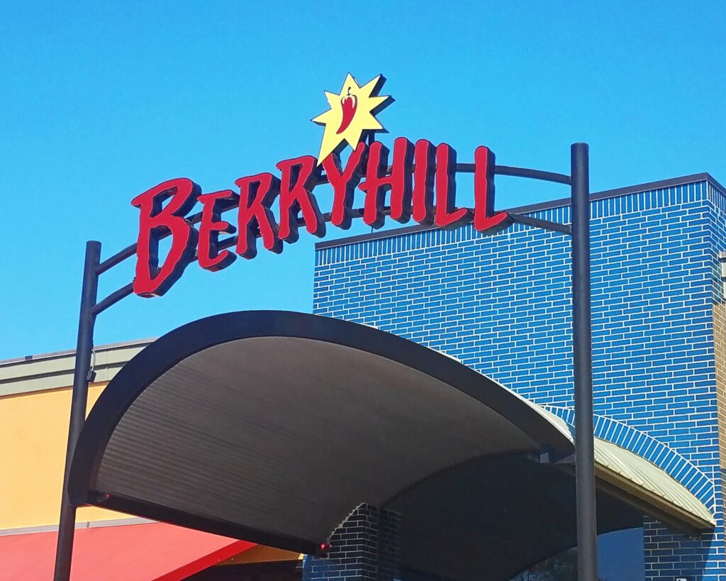 A red channel-letter and neon arch sign over the Berryhill Baja Grill entrance, built by 4D SignWorx in Houston