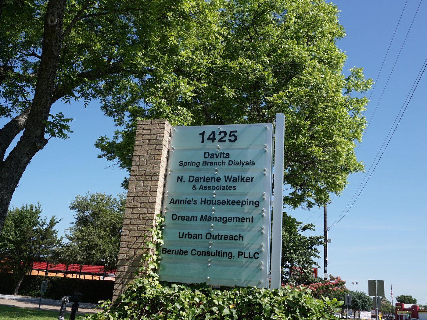 A masonry tenant directory monument with changeable panels for a Houston shopping center, built by 4D SignWorx