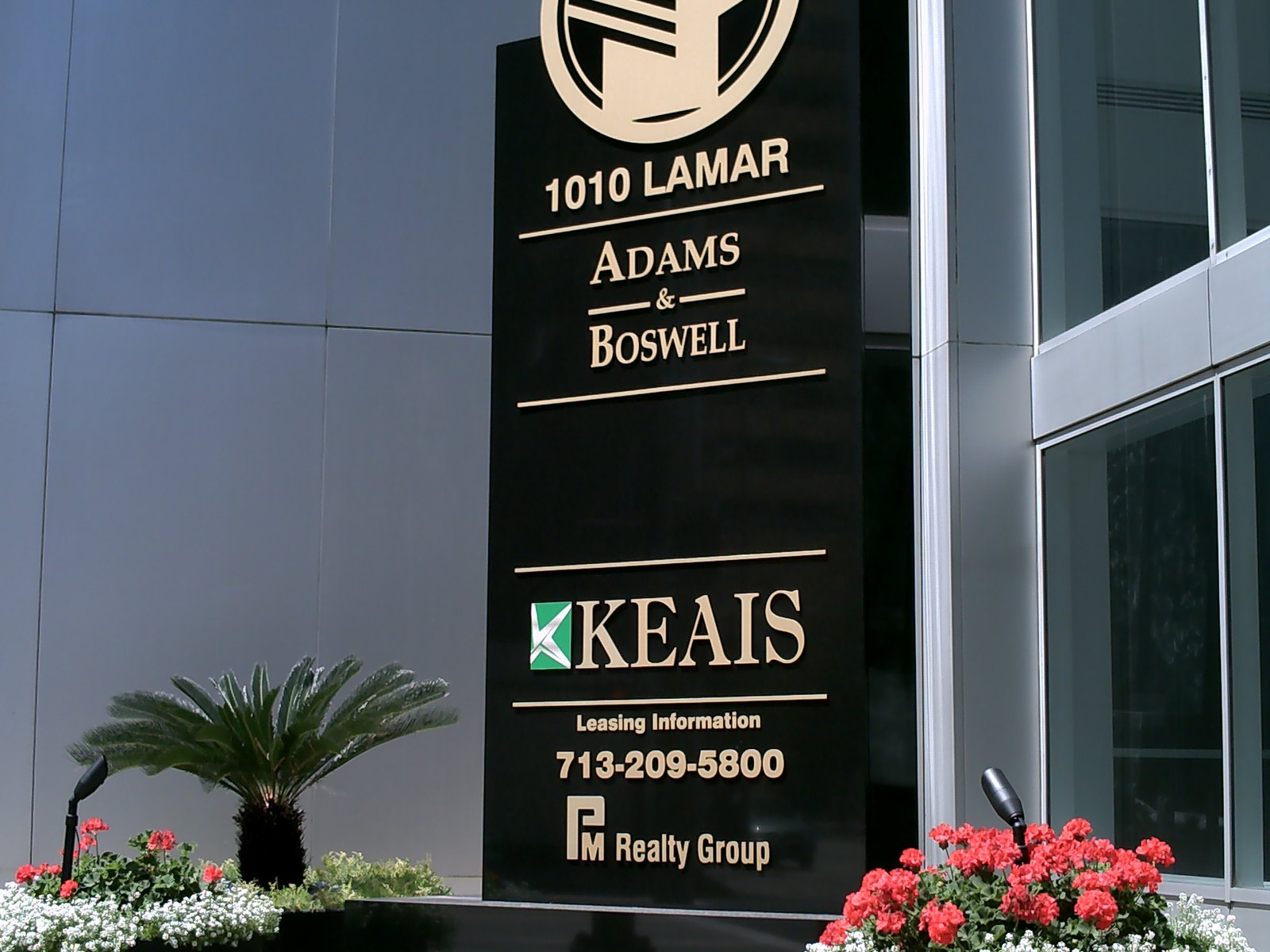 A black granite tenant monument at a downtown office entrance, built by 4D SignWorx