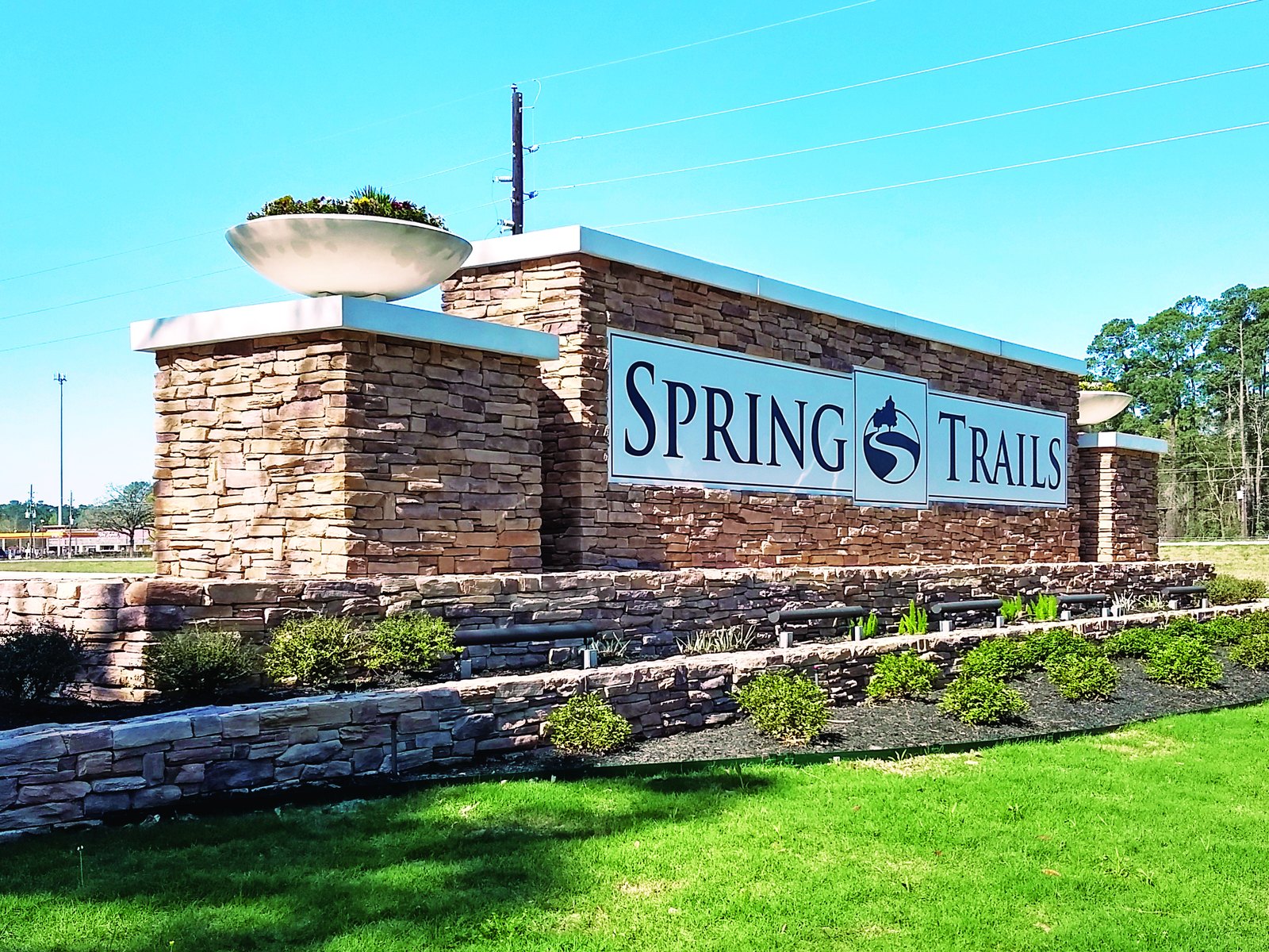 A stone community entrance wall for Spring Trails, built by 4D SignWorx