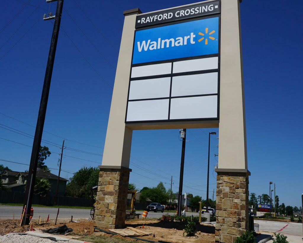 A stone-column tenant pylon at Rayford Crossing in Spring, built by 4D SignWorx